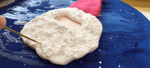 The motion of the toothpick outlining the beard