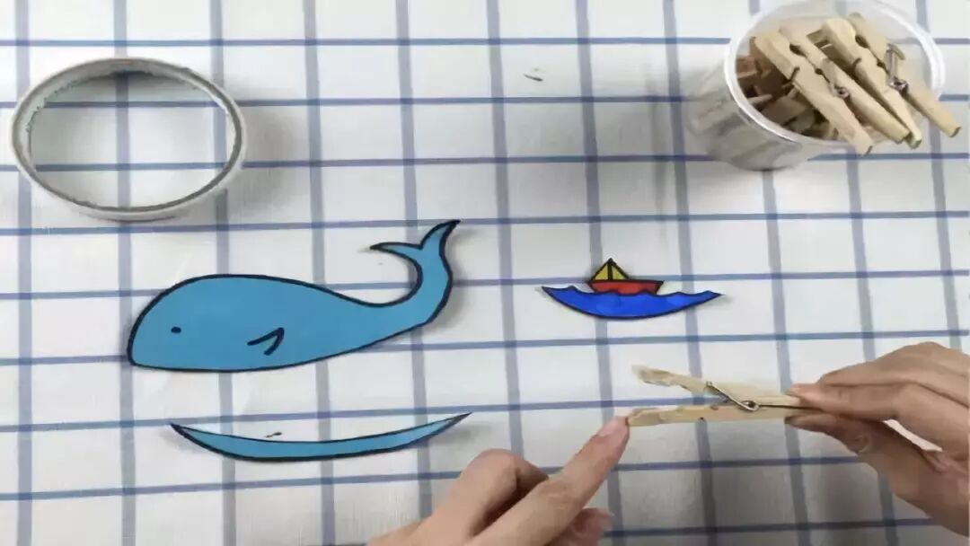 Apply double-sided tape to the front of both the top and bottom ends of the clothes peg.