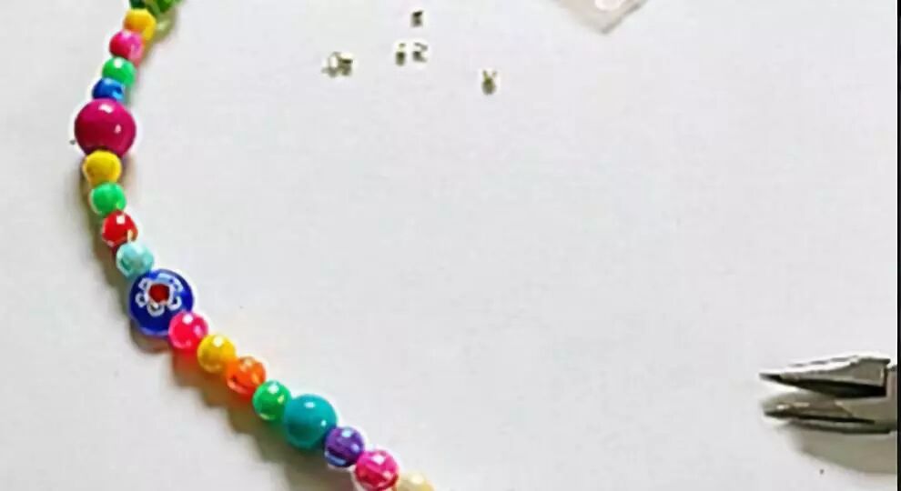 String colorful beads onto the wire and tie a knot at the end